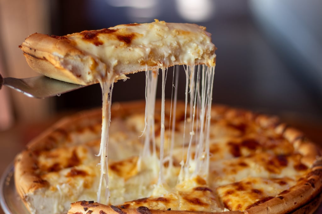 Picking up a garlic cheese bread slice