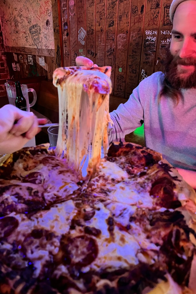 Picking up a heavy slice of pizza